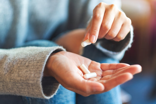 Woman with a white capsule